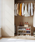 White Bamboo Shoe Rack Organizer For Closet And Entryway Free Standing Three Tier Wooden Shoe Shelf For Tight Spaces in a closet.