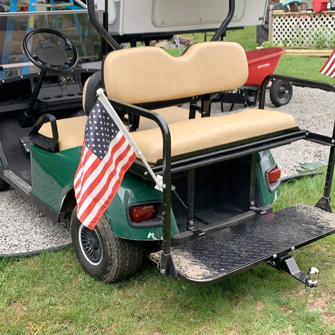 Premium Golf Cart Trailer Hitch Receiver Universal Fit For Club Car Ezgo Yamaha mounted on a green golf cart with footrest.
