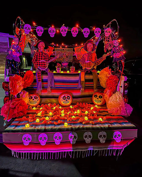 Halloween-themed truck decorated with 12 Pack Flameless Tea Lights With Timer Auto On For 6 Hours, Off 18 Hours Everyday.