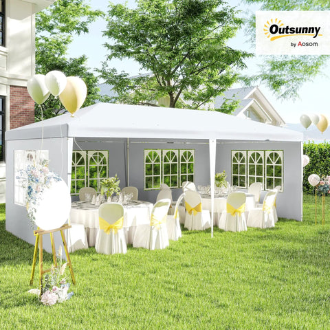 10 By 20 Foot Large Outdoor Party Tent Shelter With Four Removable Window Sidewalls For Weddings Events Markets Backyard Gatherings White Canopy Perfect For Outdoor Weddings Parties And Events With UV Rain Protection And Easy Setup, shown set up in a garden with decorated tables and chairs inside.