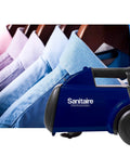Lightweight Canister Vacuum Cleaner For Smooth Carpet Sweep With 800 Watt Engine And Four Flexible Hose Tools next to neatly hung shirts.