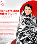 Person wrapped in Mylar Rescue Emergency Blanket For Survival, Extra Large 54 By 84 Inch Silver Thermal Sheet Reflects Heat Up To 90 Percent, Weatherproof Emergency Gear For Outdoors And Homes, Durable Pack Of 20 Count