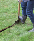 Person digging trench for DIY Self Install In Ground Automatic Sprinkler System Kit For Medium Lawn No Sweat Auto Watering From Outdoor Faucet With Retractable Sprinklers For A Clean Lawn Look.