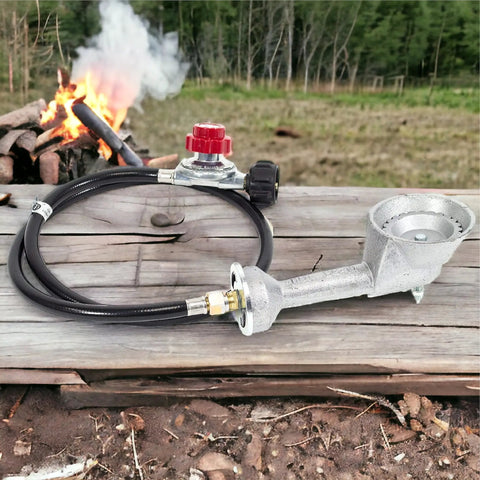 High Pressure Cast Iron Round Burner Head With Brass Fitting Regulator And Four Foot Hose Included Universal Replacement For Outdoor Grills Griddles And Propane Stoves Supports 0 To 20 Psi displayed outside near a campfire
