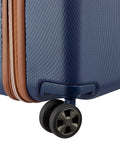 Delsey 26-inch spinner luggage corner with wheel and basketweave texture showcasing durability and style in navy blue.