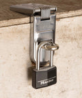 Black Covered Aluminum Lock with Key for Gym Lockers and Outdoor Use securing a toolbox with a long shackle padlock