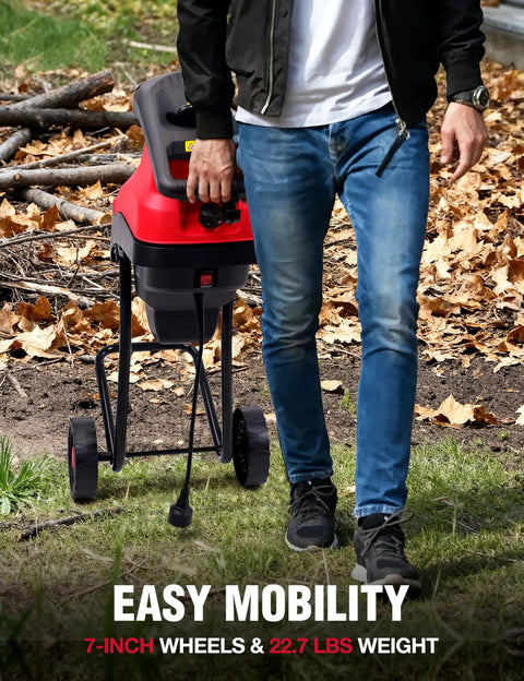 Person moving Electric Wood Chipper Shredder for Yard Cleanup with wheeled base