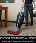 Tradition Upright Commercial Bagged Vacuum Cleaner Workhorse for Heavy Duty Carpet Cleaning in use on a hotel carpet