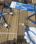 6 Inch Precision Wire Cutters For Jewelry Making, Ultra Sharp Flush Cutters, displayed on cardboard with a glove holding one pair