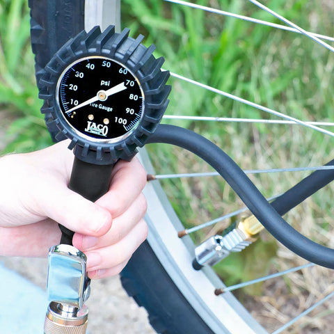 JACO FlowPro Tire Inflator with Pressure Gauge, front view attached to bicycle tire valve.