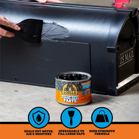 Hand applying Waterproof Patch And Seal Rubberized Sealant Paste Black 1Lb Can Heavy Duty Instantly Seals Water Air And Moisture