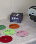 5 Inch Diamond Polishing Pads Wet Dry Set for Marble Quartz Granite Concrete, 8 piece kit with various grits on countertop