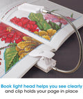 2 In 1 Sewing Machine Light With Clip On Lamp And Magnifier attached to a book with colorful embroidery design