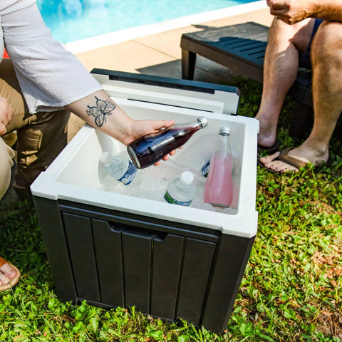 9 Gallon Outdoor Beverage Cooler with Insulated Ice Chest that Holds 40 Cans for Backyard Parties, shown open by a poolside.