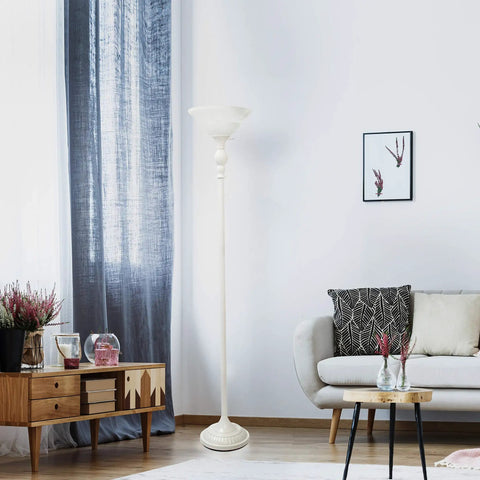Living room with tall white floor lamp next to sofa and wooden table against decorative wall and curtain background.