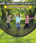 Children playing on a Climbing Net For Kids Double Layer Heavy Duty Backyard Playground Safety Net 9.9 Feet By 9.9 Feet in a park.