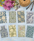 Mini Pocket Spiral Notebooks Bundle - 24 Count, 2.36 x 3.94 Inches, 8 Vintage William Morris Floral Covers displayed.