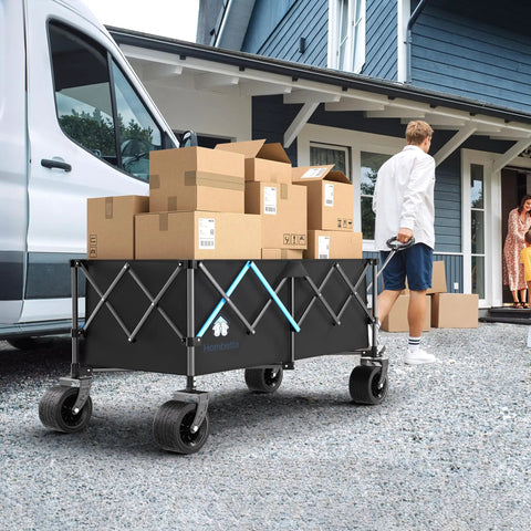 Heavy Duty 48 Inch XL Collapsible Wagon Cart With All Terrain Wheels And 560 Lb Capacity For Camping, Beach, Garden, Sports, Shopping And More Built To Haul Heavy Gear Everywhere loaded with boxes.