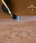 Hand applying Water Based Crystal Clear Ultimate Polyurethane For Interior Wood Protection With Fast Dry Time on wood surface.
