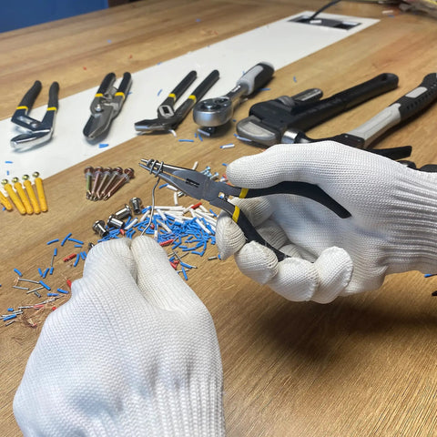 Person using 5 Pack Mini Precision Needle Nose Pliers Set With Wire Cutter, Spring Loaded, Black Finish for delicate wire work