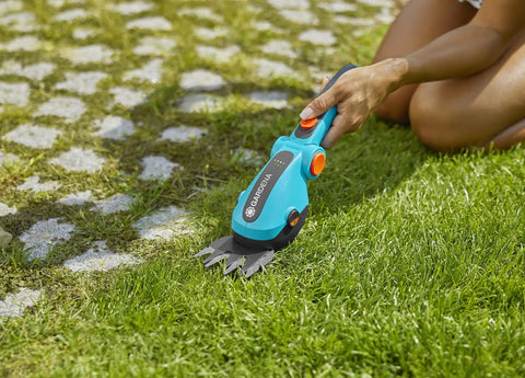 Using Cordless Hedge Trimmer And Grass Shears For Easy Lawn Edges And Shrubs Battery Powered Handheld Electric Garden Tool with long runtime