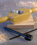 Pro Grade Tap And Die Set 1-1/4 Inch Wood Thread Kit with two-handed thread box and bottoming tap on wooden surface