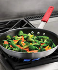 Heavy Duty 12 Inch Nonstick Frying Pan With Slick Release Coating Built Like A Tank For Family Portions And Fast Weeknight Grub No Sweat Cooking with sautéed vegetables.