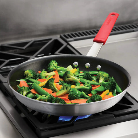Heavy Duty 12 Inch Nonstick Frying Pan With Slick Release Coating Built Like A Tank For Family Portions And Fast Weeknight Grub No Sweat Cooking with sautéed vegetables.