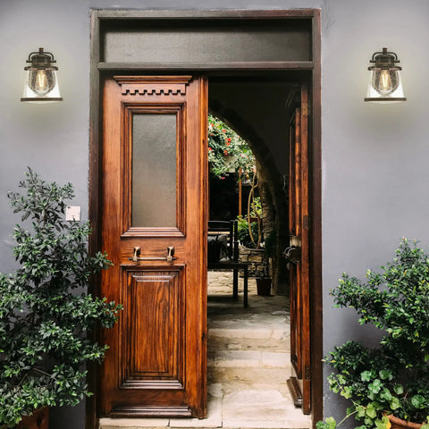 Outdoor Wall Mount Lantern Sconce In Oil Rubbed Bronze With Clear Seeded Glass Dusk To Dawn Sensor Weatherproof Exterior Porch Lights 2 Pack on stone wall flanking wooden entry door