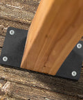 Top view of one 4x4 wooden post secured with a Two Pack 4x4 Post Anchor Plates For Decks, Wood Fences, Mailboxes And Posts, Heavy Duty Structural Steel Post Bases With Predrilled Holes For Easy Concrete Install