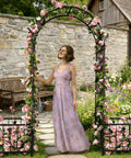 Woman standing under Garden Arbor With Planter Boxes 76 Inch Wide By 86 Inch High Black Metal Archway For Climbing Plants Outdoor Lawn