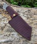 Brown leather sheath with visible Damascus steel blade, part of the Damascus Knife Making Kit With DIY Knife Set Includes Meat Cleaver Blank