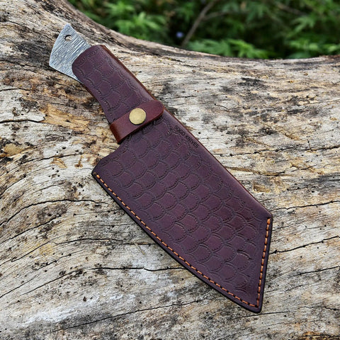 Brown leather sheath with visible Damascus steel blade, part of the Damascus Knife Making Kit With DIY Knife Set Includes Meat Cleaver Blank