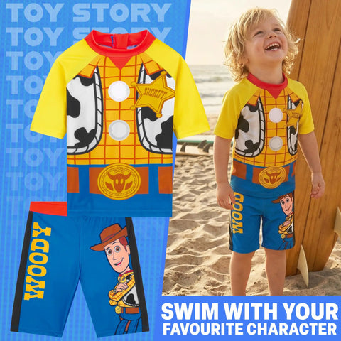 Two Piece Toy Story Boys Rash Guard And Swim Trunks Set With Woody And Buzz Lightyear Graphics displayed on sandy beach
