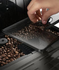 Real Deal Fully Automatic Espresso Machine With Single Touch Lattecrema Setup For Creamy Cappuccino Foam Black Coffee Maker showing coffee bean compartment.