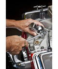 Person using No-Nonsense 12 Point Ratcheting Combination Wrench 1-3-8 Inch Off-Corner Box End Slim Head on engine bolts.
