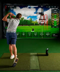 Golfer using Launch Pro Golf Launch Monitor with Ball and Club Data in indoor simulator with software display of Paris course.