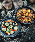 Six Quart Cast Iron Camping Dutch Oven with lid lifter and storage bag for campfire cooking stews and baking