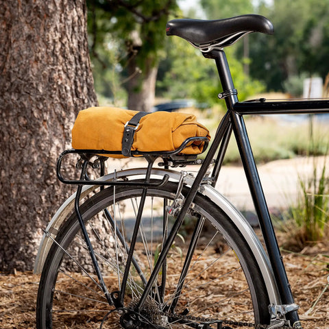 Bike with rack secured using All Purpose Utility Strap 18 Inch Tie Down With 70 Lb Load Capacity Ideal For Securing Bikes Gear Skis Tarps Ladders Cords And More On Racks Or In The Garage Heavy Duty Yet Stretchy And Easy To Use.
