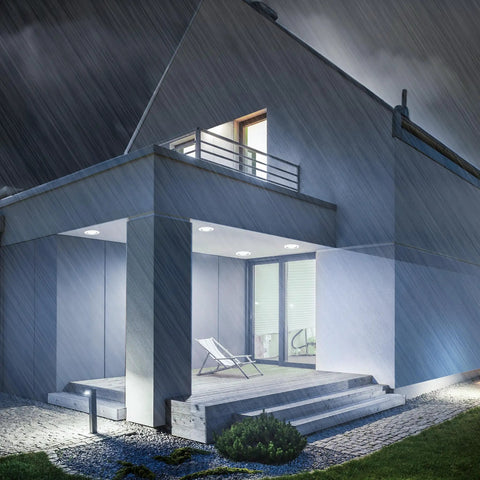 Modern house exterior lit by PAR38 LED Flood Light Bulb Mega Bright 5000 Lumens Daylight 5000K, outdoor damp rated.