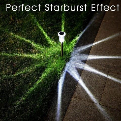 10 Pack Solar Powered Path Lights Waterproof Stainless Steel Stake Lights illuminated on grass with starburst effect