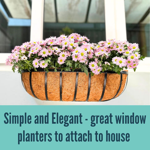 Slap These Black Metal Wall Planters On Any Deck Railing For A Quick Backyard Glow Up With A 2 Pack Of 24 Inch Outdoor Garden Boxes Equipped With Natural Coco Liners For Fence Balcony And Patio Vibes with pink daisies.