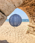 Boho Outdoor Solar Lantern With Weatherproof Tyvek Fabric, Dual White LEDs, Stainless Steel Frame, Easy Hang Design in a beach setting