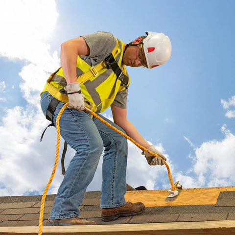 Worker using Rooftop Safety Kit With 50 Foot Vertical Lifeline Assembly and Reusable Temporary Anchor on roof