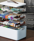 CTIME 4-tier XL medicine organizer with leather handle; white base and clear drawers filled with pills
