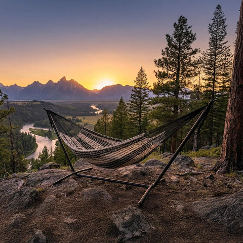 XXL Handwoven Mayan Double Hammock For Outdoor Use With Thick Cord 156 Inch Wide 90 Inch Deep And 625 Pound Capacity Heavy Duty Outdoor Hammock In Black And Natural set up on a mountain overlook at sunset.