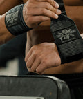 Man adjusting 18 Inch Heavy Duty Wrist Wraps For Weightlifting And Powerlifting With Ultra Strong Support For Bench Press, Deadlifts, Curls, CrossFit, And General Gym Workouts For Men