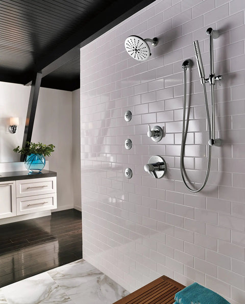Compel Slide Bar Handheld Shower System With Hose In Chrome installed in modern bathroom with white tile wall.
