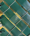 Close-up of Chain Link Fence Privacy Slats Tape Roll 250 Ft By 0.15 Ft Includes 200 Fasteners And Punch Tool UV Inhibited Green Polyethylene