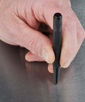 Hand using Center Punch 5 Piece Set for Metalworking, Pro Grade Chrome Alloy Steel with Hardened Ends for precise hole marking.